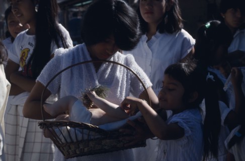 MEXICO, Mexico State, Chalma, Girls dressed in white and carrying lifesize infant figure during