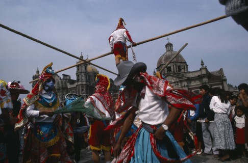 MEXICO, Mexico City, "Our Lady of Guadelope Festival dancers, musicians and acrobats in front of