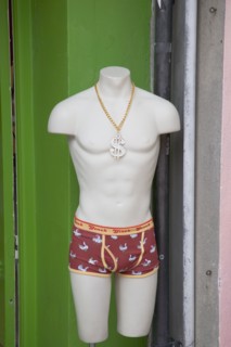 ENGLAND, East Sussex, Brighton, "Male manekin torso in Kensington gardens, North Laines shopping