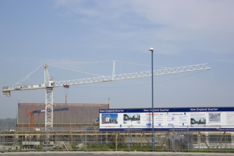 ENGLAND, East Sussex, Brighton, Construction crane in the New England quarter next to railway