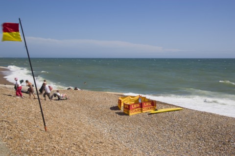 ENGLAND, East Sussex, Brighton, Life guard station on the beach at Hove.
