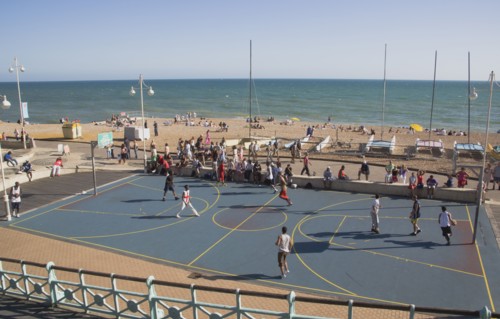 ENGLAND, East Sussex, Brighton, Basketball court on the seafront.