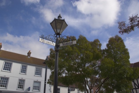 ENGLAND, Hampshire, Emsworth, Main square with signs pointing to Portsmouth and the Harbour.