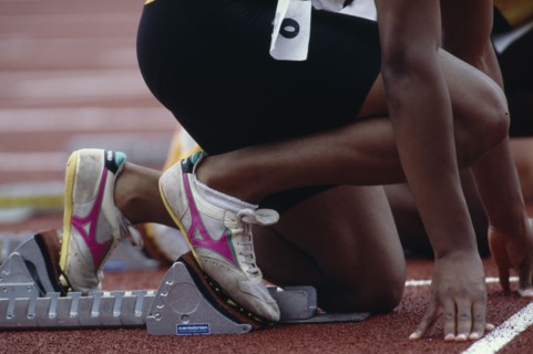 SPORT, Athletics, Male Track, Cropped view of runner on starting blocks at the start of 100 m event
