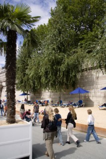 FRANCE, Ile de France, Paris, The Paris Plage urban beach. People strolling between the River Seine