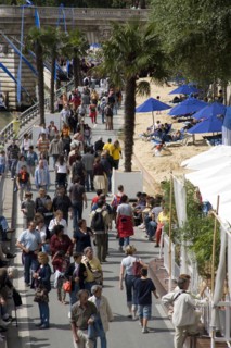 FRANCE, Ile de France, Paris, The Paris Plage urban beach. People strolling between the River Seine