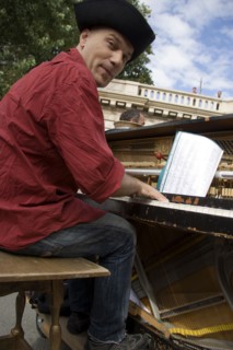 FRANCE, Ile de France, Paris, The Paris Plage urban beach. A singer playing a piano to an audience