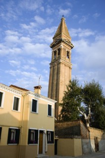 ITALY, Veneto, Venice, The leaning bell tower of the church on the lagoon island of Burano set