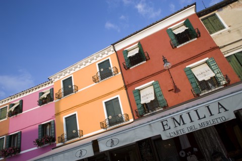 ITALY, Veneto, Venice, "Brightly coloured houses above lace shops on the lagoon island of Burano,