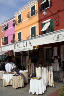 ITALY, Veneto, Venice, Brightly coloured houses above lace shops on the lagoon island of Burano the