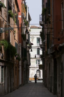 ITALY, Veneto, Venice, View down a narrow street to the Grand Canal in the San Polo and Santa Croce
