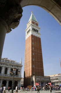 ITALY, Veneto, Venice, The Campanile in Piazza San Marco seen through an arch below the Doges