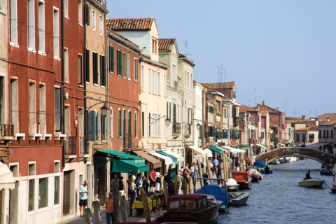 ITALY, Veneto, Venice, Tourists walking along the Fondamenta dei Vetrai with boats moored on the