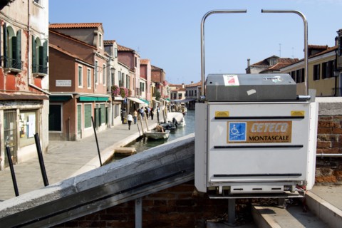 ITALY, Veneto, Venice, A mechanically operated wheelchair ramp on a bridge across the Rio dei