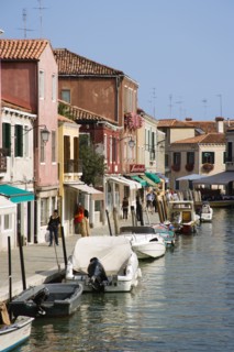 ITALY, Veneto, Venice, Tourists walking past shops along the Fondamenta dei Vetrai with boats