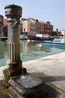 ITALY, Veneto, Venice, A free public drinking water fountain on the Canale di San Donato on the