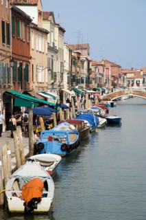 ITALY, Veneto, Venice, Tourists walking past shops along the Fondamenta dei Vetrai with boats