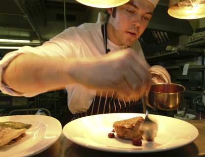 ENGLAND, Bristol, Bristol, Chef Plating Up Fillet Steak and Raspberry Coulis