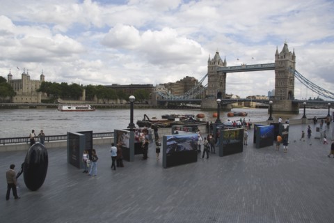 ENGLAND, London, The Queens walk open air exhibition outside the GLA city hall with Tower Bridge
