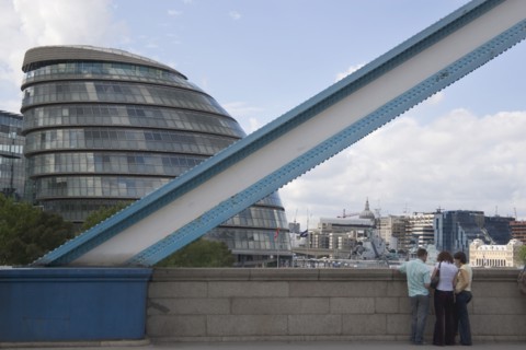 ENGLAND, London, Detail of Tower bridge with the GLA City Hall glass offices behind. Designed by