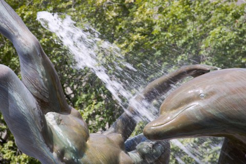 ENGLAND, London, "St Catherine’s Dock, fountain of woman with dolphin sited outside the Tower