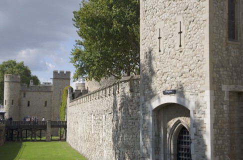 ENGLAND, London, The Tower of London showing moat and battlements.