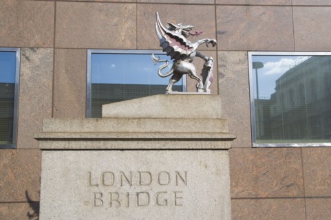 ENGLAND, London, London Bridge detail with statue of Griffin on the Southwark side. Griffins mark