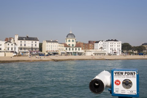 ENGLAND, West Sussex, Worthing, View from the pier across the sea towards The Dome Cinema and