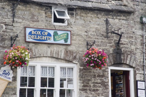 ENGLAND, Dorset, Corfe, Detail of an Ice Cream Parlour in a traditional cottage with hanging