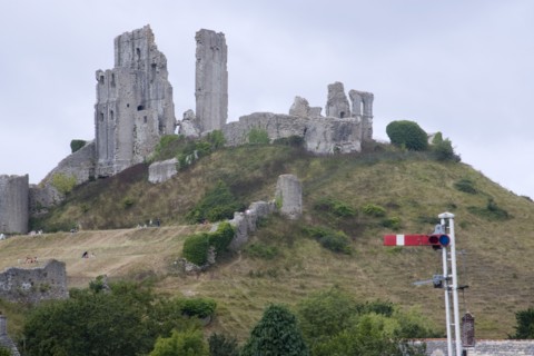 ENGLAND, Dorset, Corfe, Corfe Castle seen from the train station platform.