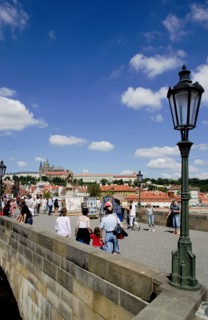 CZECH REPUBLIC, Bohemia, Prague, Tourists on the Charles Bridge across the Vltava River with Prague
