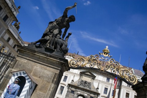 CZECH REPUBLIC, Bohemia, Prague, Sentry beside Guardbox under 18th century statues of fighting