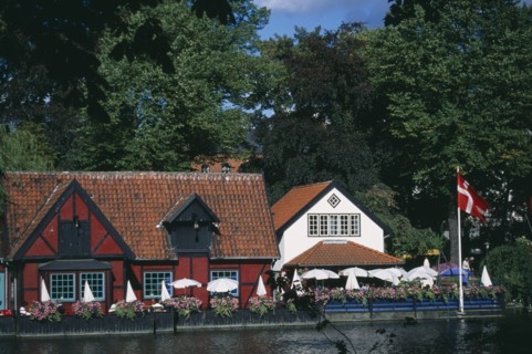 DENMARK , Zealand, Copenhagen, Tivoli Gardens. Colourful cafes and restaurants.