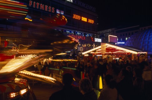 GERMANY, Berlin, Breitscheidplatz. Christmas Market. Funfair and stalls colourfully Illuminated at