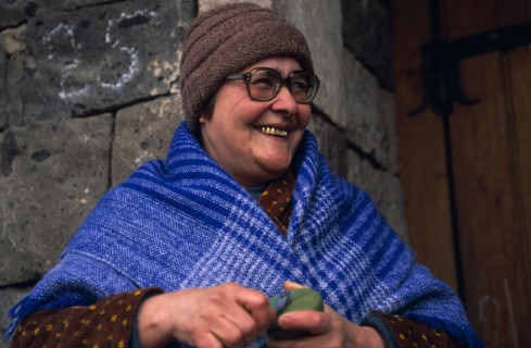 ARMENIA, People, "Portrait of smiling woman wearing blue shawl, hat and glasses and with several