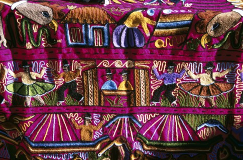 PERU, Near Cusco, Ollantaytambo, "Colourful patterned embroidered cloth in the market,