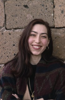 ARMENIA, People, "Head and shoulders portrait of smiling young woman with long, dark hair."