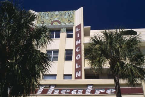 USA, Florida, Miami, South Beach. Lincoln Avenue. The Lincoln Theatre exterior with palm trees