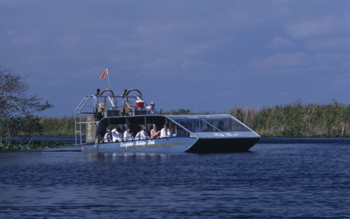 USA, Florida, Fort Lauderdale, Tourists Air boating in the Everglades National Park