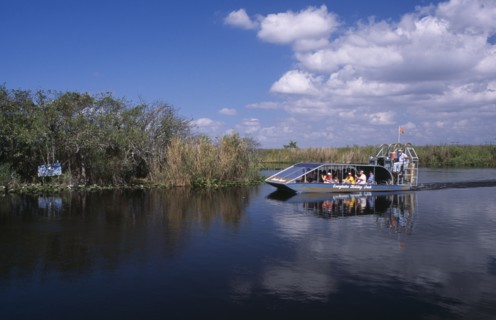 USA, Florida, Fort Lauderdale, Tourists Air boating in the Everglades National Park