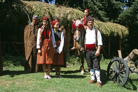 BULGARIA, Pirin Mountain, Chalin Valog, Girls dressed in Bulgarian national costume and men dressed