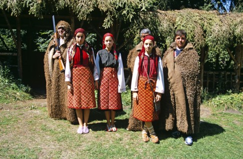 BULGARIA, Pirin Mountain, Chalin Valog, Girls dressed in Bulgarian national costume and men dressed