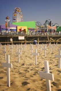 USA, California, Santa Monica, A graphic protest against the war in Iraq beneath Santa Monica Pier.