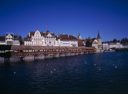 SWITZERLAND, Lucerne Central, Lucerne, Kappelbrucke flower decked covered bridge spanning across
