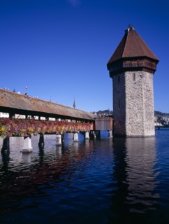 SWITZERLAND, Lucerne Central, Lucerne, Kappelbrucke flower decked covered bridge spanning across