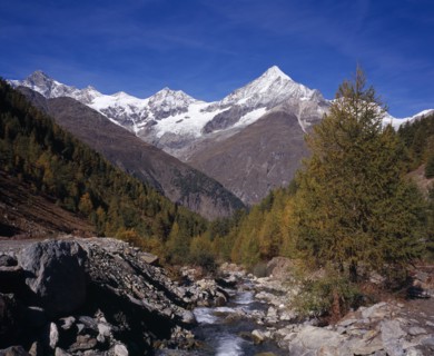 SWITZERLAND, Valais, Weisshorn Mountain, River Taschbach with the Snow capped Weisshorn  Mountain