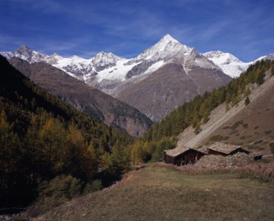 SWITZERLAND, Valais, Ottavan Hamlet , Storage Barns high above Mattertal Weisshorn Mountain 14757ft