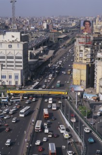 EGYPT, Cairo Area, Cairo, Elevated view over busy city road network with traffic running between