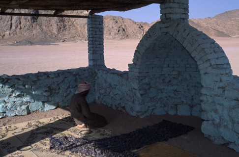 EGYPT, Religion, Islamic, Bedouin man worshipping in Eastern Desert Mosque made with brick and