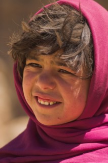 AFGHANISTAN, Bamiyan Province, Bamiyan , Girl that lives in a cave in the cliffs near empty niche